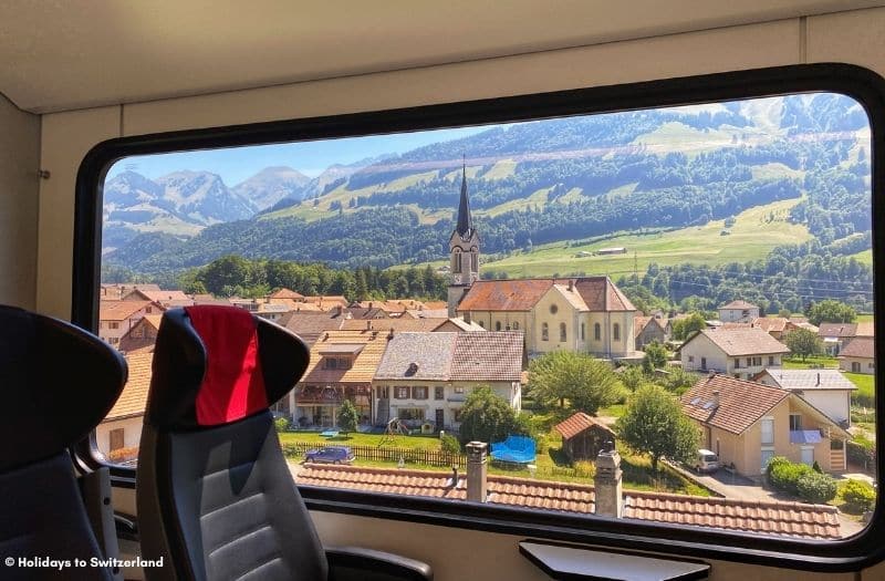 Scenic view through train window in rural Switzerland